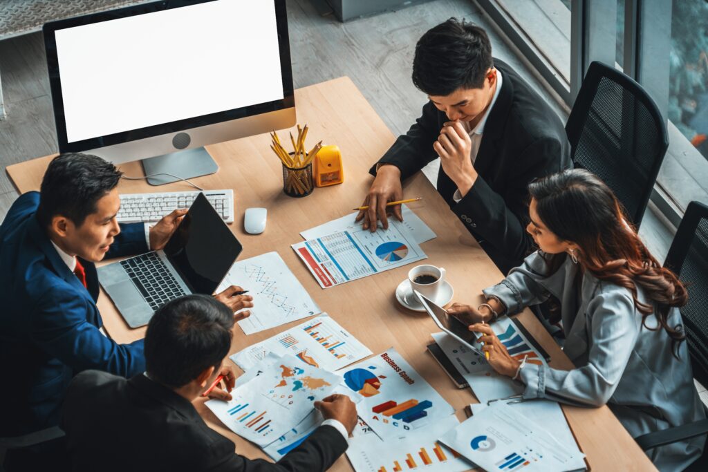 A direct sales team working together in the office.